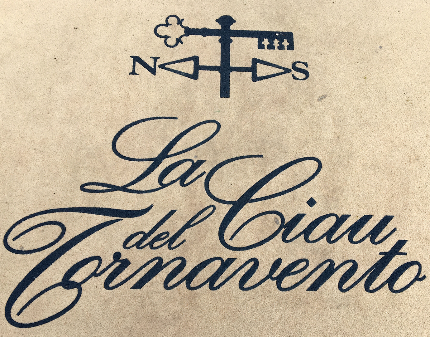 Logo in script typeface for La Ciau del Tornavento