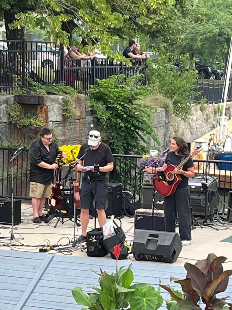 rock musicians in front of rocks at the lock