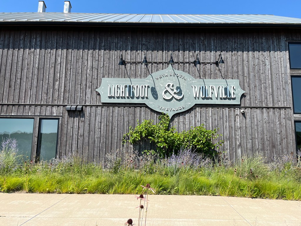 Wooden building with Lighthall & Wolfville sign on the side